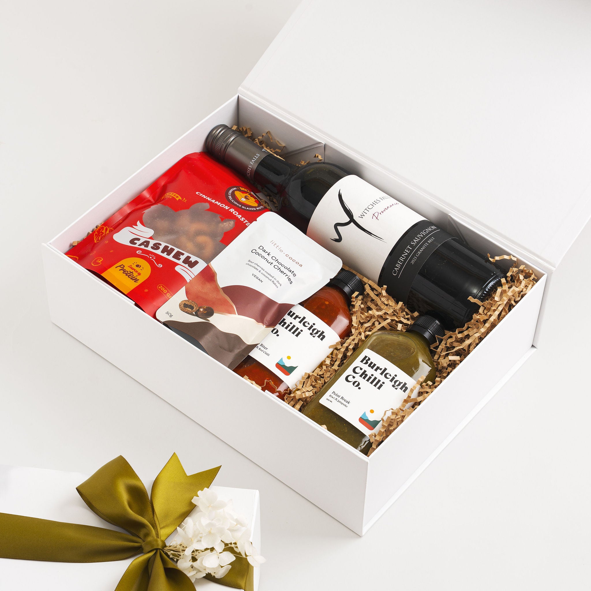 Luxury Gold Coast gift hamper with wine, chilli sauces and gourmet snacks