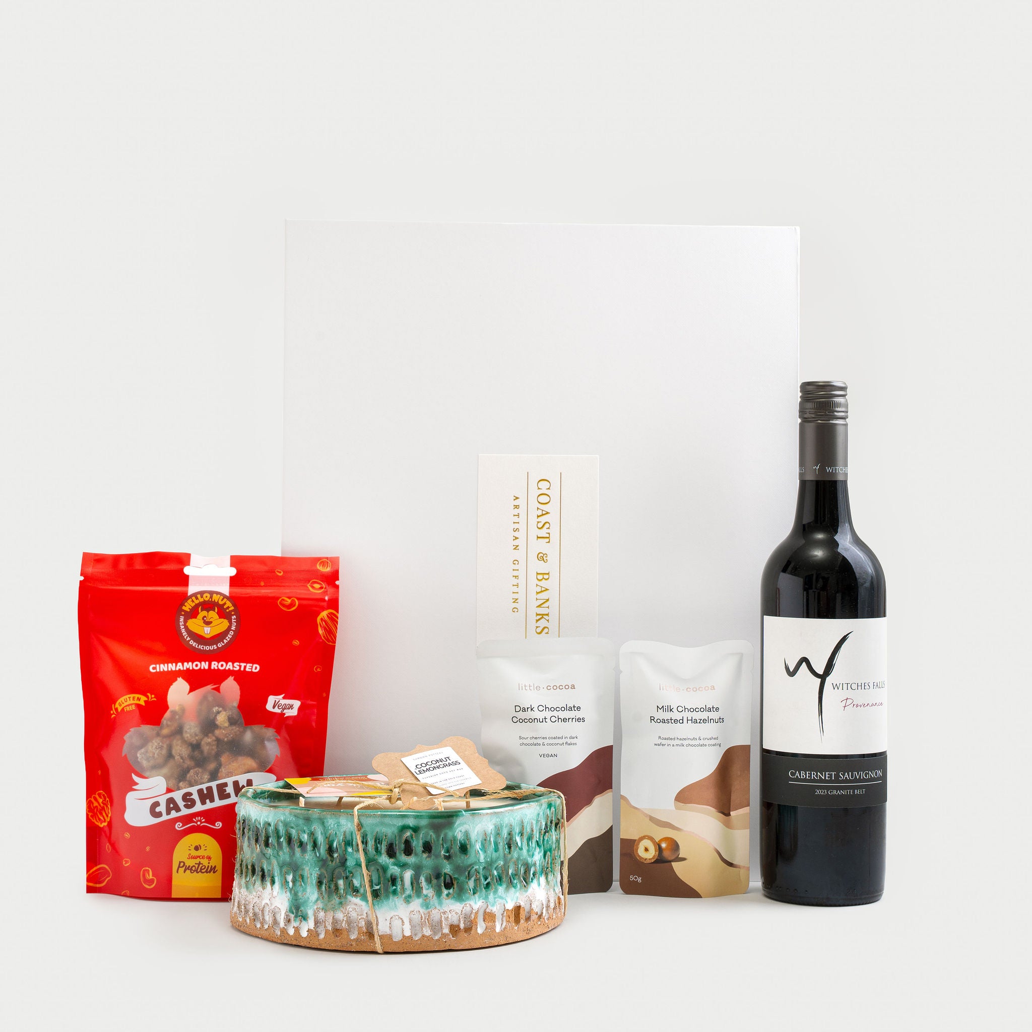 Gold Coast wine and candle gift hamper with ceramic candle and gourmet treats
