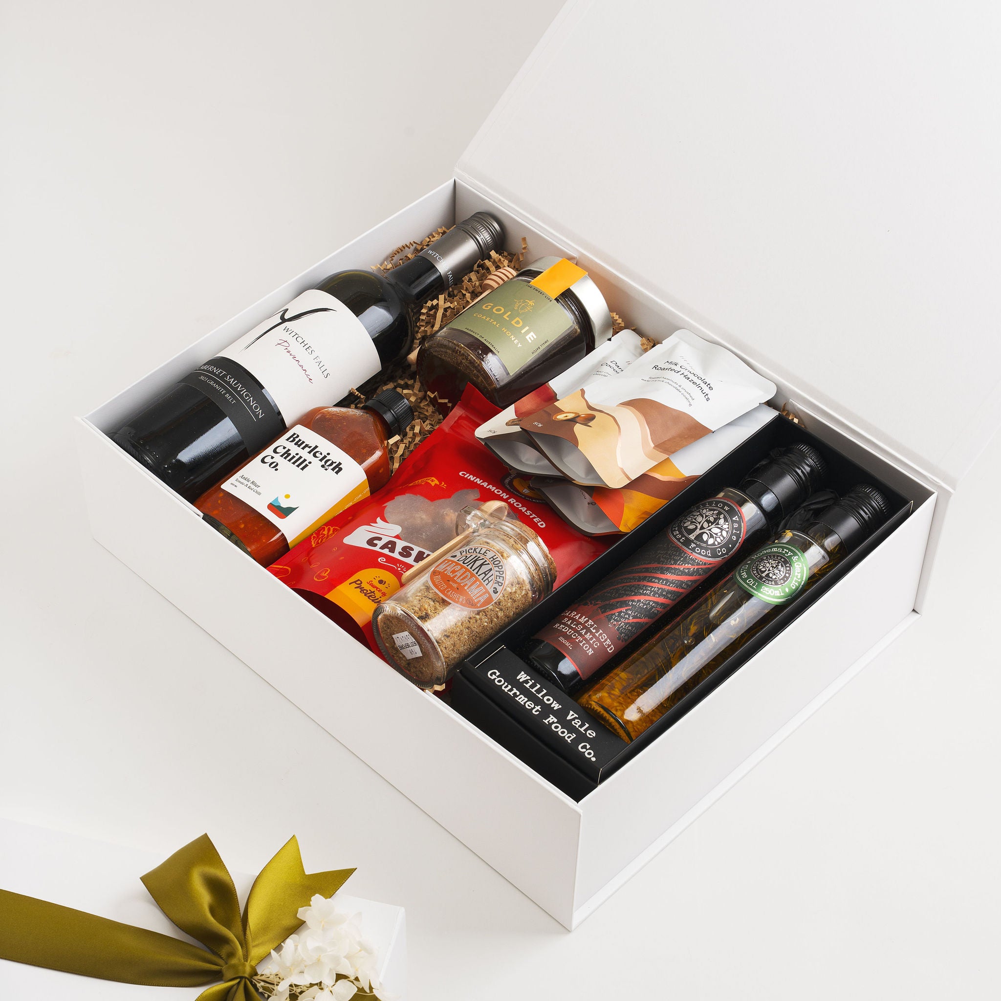 Luxury Gold Coast gourmet gift hamper with Witches Falls Cabernet Sauvignon and local products.