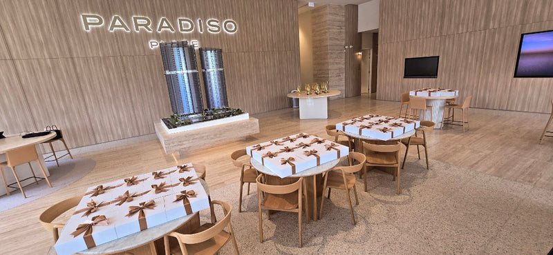 Modern restaurant interior with wooden tables and chairs, 'Paradiso' branding visible.